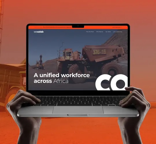 WeColab website on a laptop